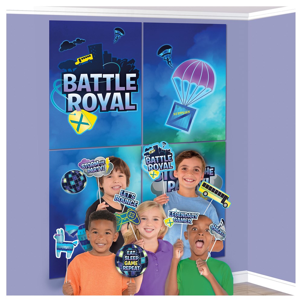 Blue and purple Battle Royal superhero-themed scene setter with parachutes and supply crates, displayed behind four children .