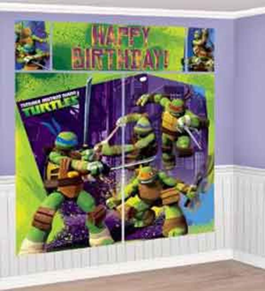Colorful Teenage Mutant Ninja Turtles wall decals with action poses and green "Happy Birthday" banner above.