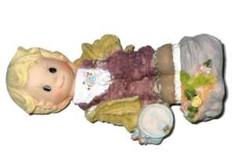 Polystone figurine of a boy with blonde hair, wearing a pink vest, white shirt, and green pants, holding a plate with food,.