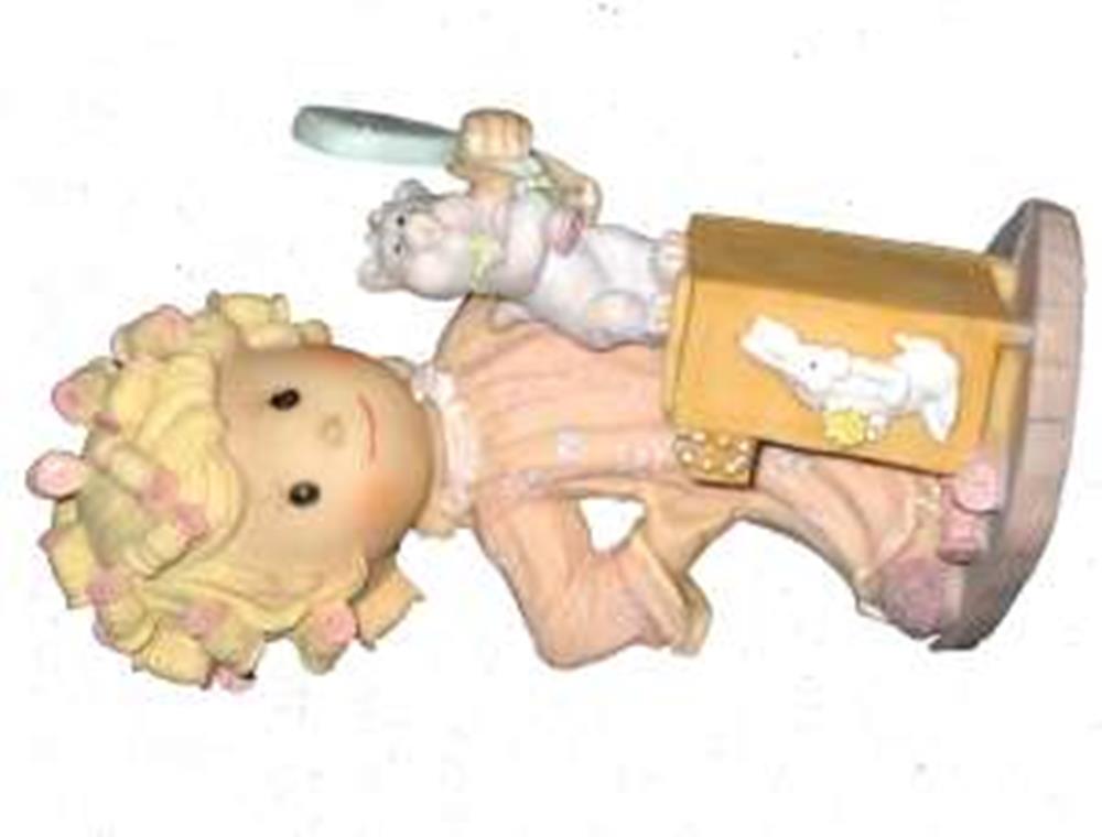 Polystone figurine of a girl with curly blonde hair holding a hair roller and shampoo bottle, wearing a pink outfit.