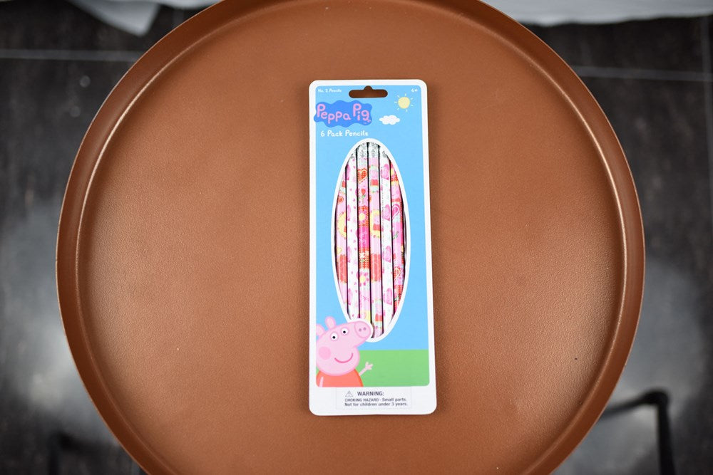 Set of six Peppa Pig-themed wooden pencils with pink and red character designs on a blue and green backing card.