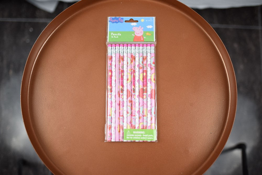 Set of 12 Peppa Pig wood pencils with pink and white animal print designs in clear plastic packaging.