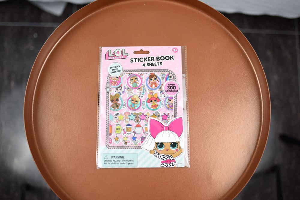 LOL Surprise sticker book with colorful, puffy character and accessory stickers, pink and white packaging.