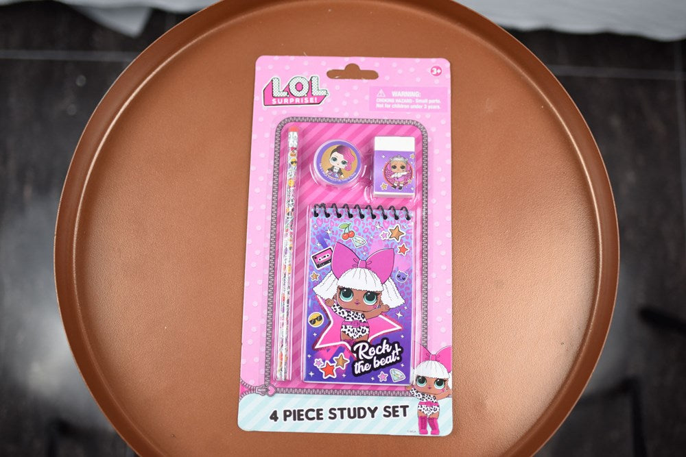 LOL Surprise 4-piece study kit with pink notebook, pencil, eraser, and sharpener in packaging.