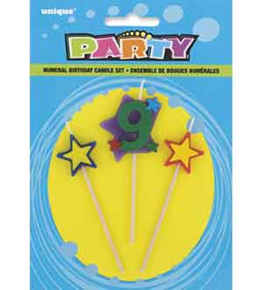 Green number 9 birthday candle with purple base and two yellow star-shaped candles on sticks.
