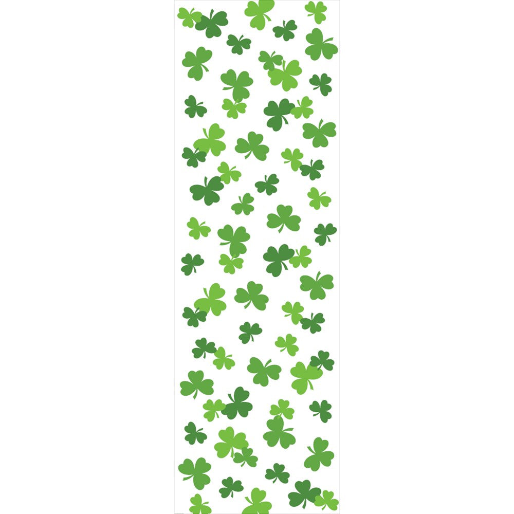 White tablecover runner printed with scattered green shamrocks in various sizes and shades.