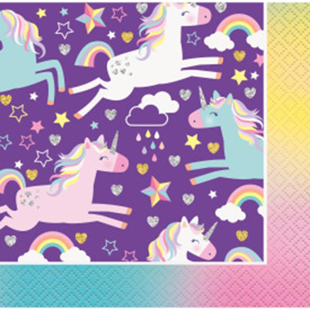 Purple napkin with pastel unicorns, rainbows, stars, clouds, and raindrops pattern.