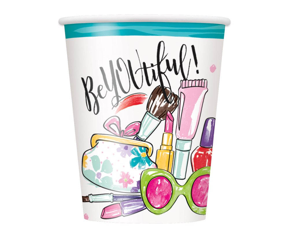 White 9oz paper cup with teal rim, featuring colorful spa-themed illustrations and "BeYOUtiful!" text.