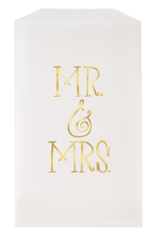 White paper treat bag with gold foil "MR. & MRS." text in elegant font.