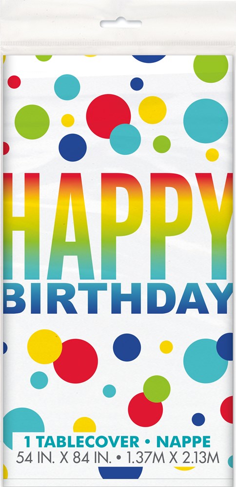 White rectangular plastic tablecover with colorful polka dots and large rainbow gradient "HAPPY BIRTHDAY" text.
