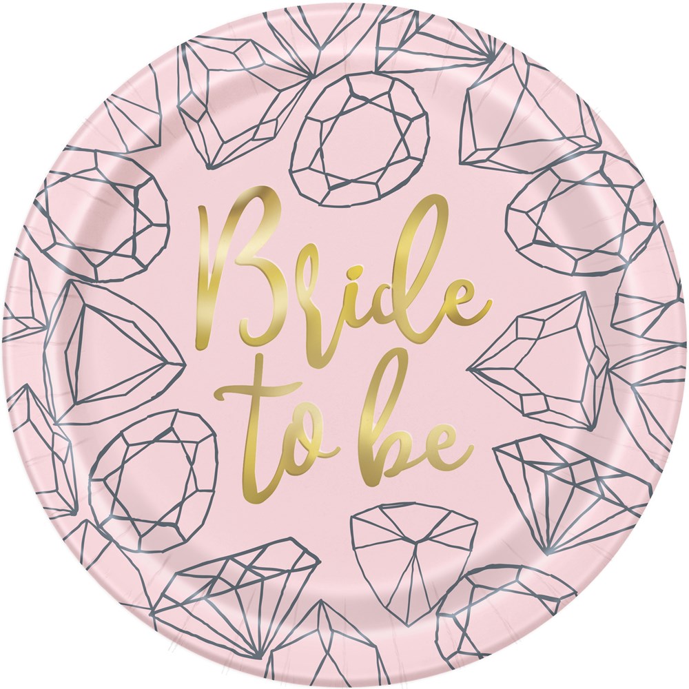 Round pink paper plate with gold foil "Bride to be" text and black diamond illustrations.