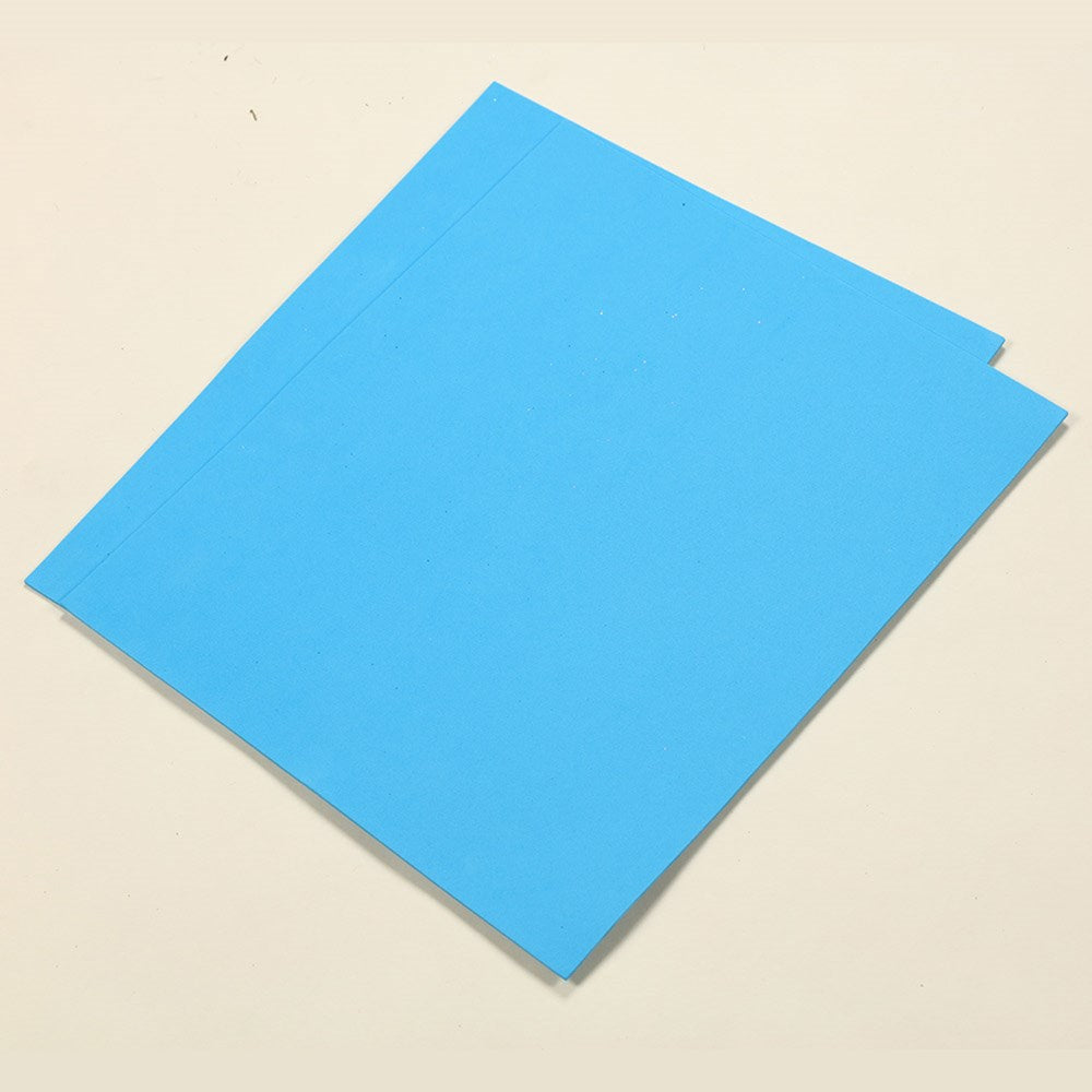 Stack of smooth, flat turquoise foam sheets measuring 13 by 18 inches.