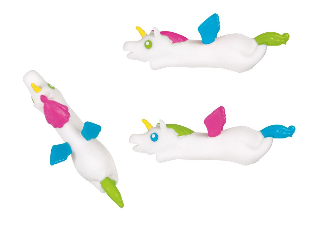 Three white rubber unicorn finger flingers with colorful wings, manes, tails, and yellow horns.