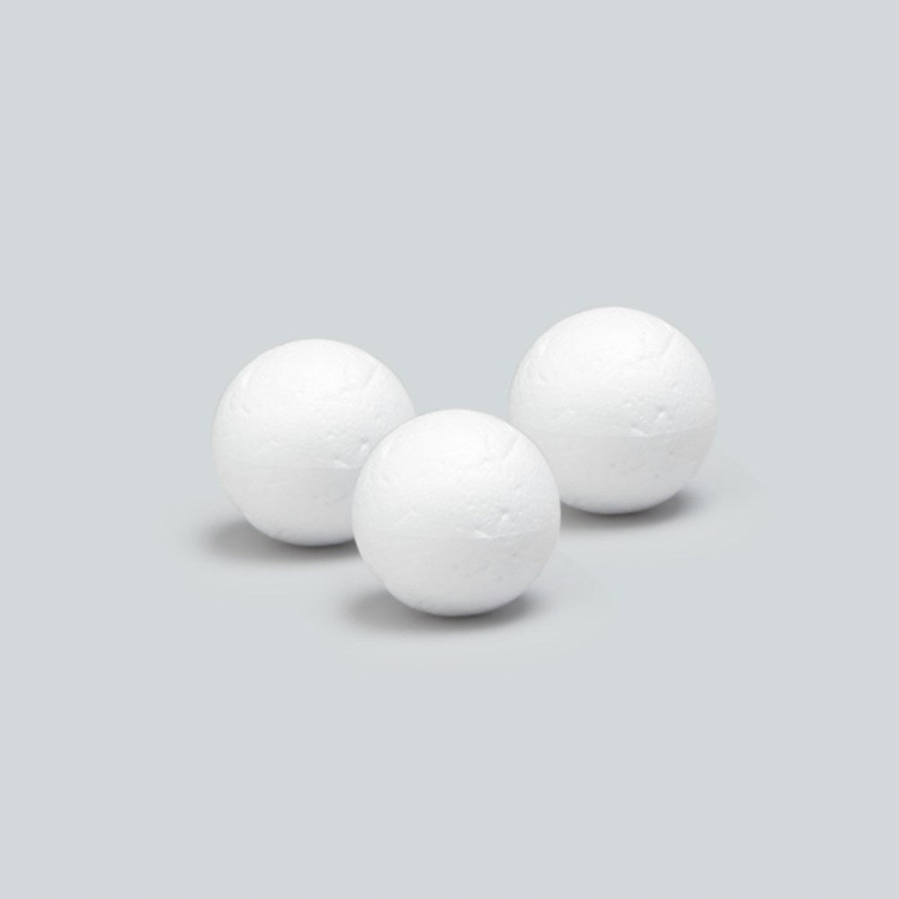 Three white 3-inch smooth styrofoam balls on a light gray background.