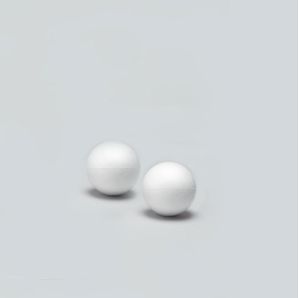 Two white smooth Styrofoam balls, each 5 inches in diameter, on a plain light gray background.