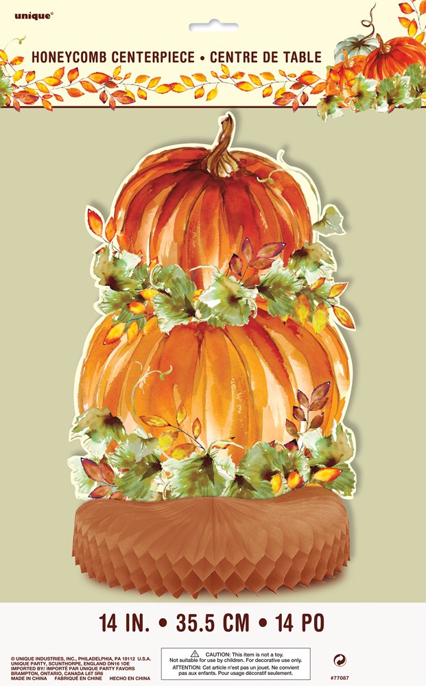 14-inch honeycomb centerpiece with layered orange pumpkins and green leaves on a brown base.