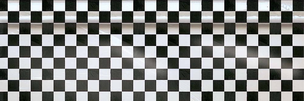 Black and white plastic table roll with printed checkerboard pattern.