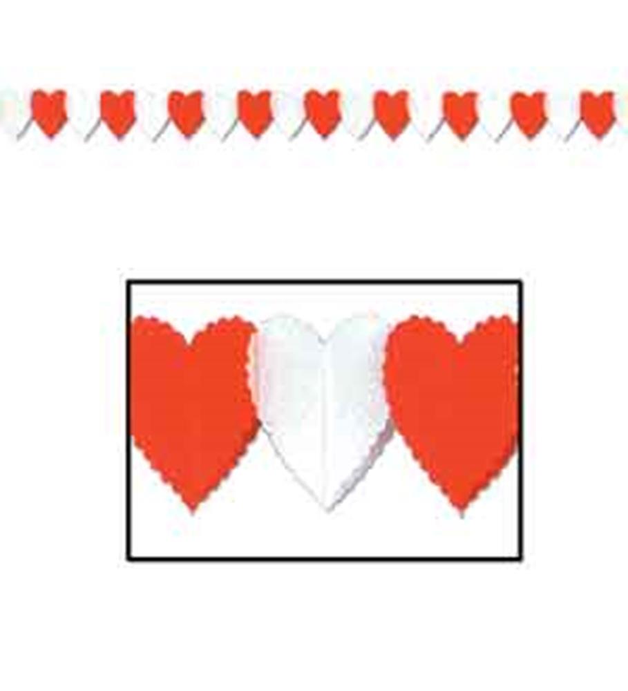 Red and white scalloped-edge paper hearts strung on a white garland rope.
