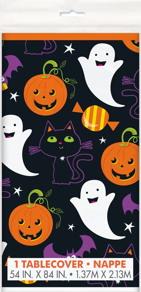 Black plastic tablecover with smiling orange pumpkins, white ghosts, black cats, purple bats, and candy designs in a.