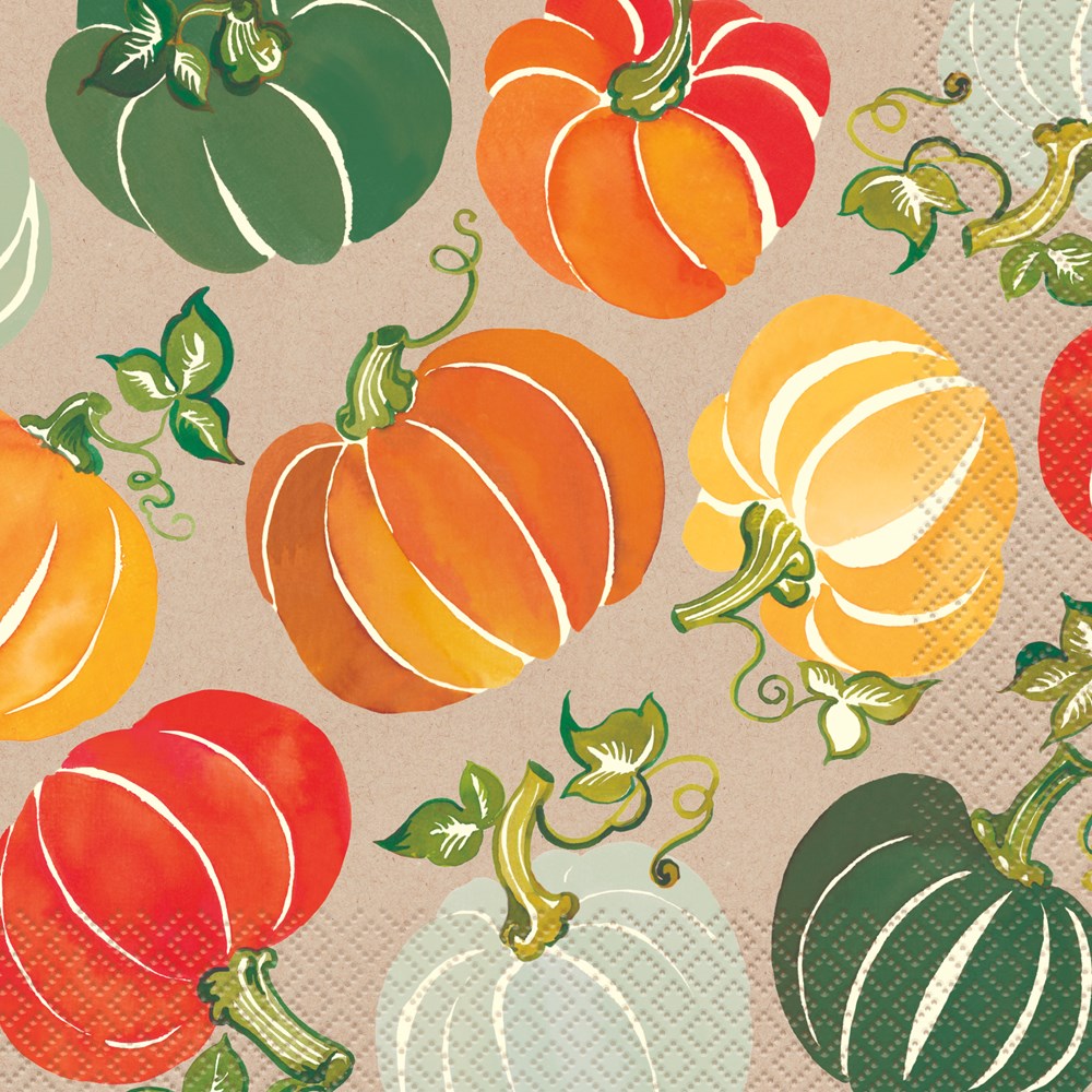 Colorful pumpkins in orange, green, white, and yellow with curly green vines on a textured beige napkin.