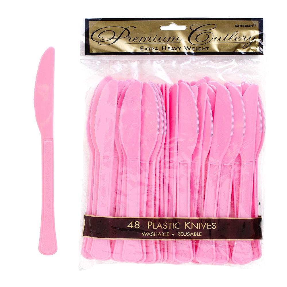 Set of 48 pink plastic knives with serrated edges, suitable for parties or casual use.