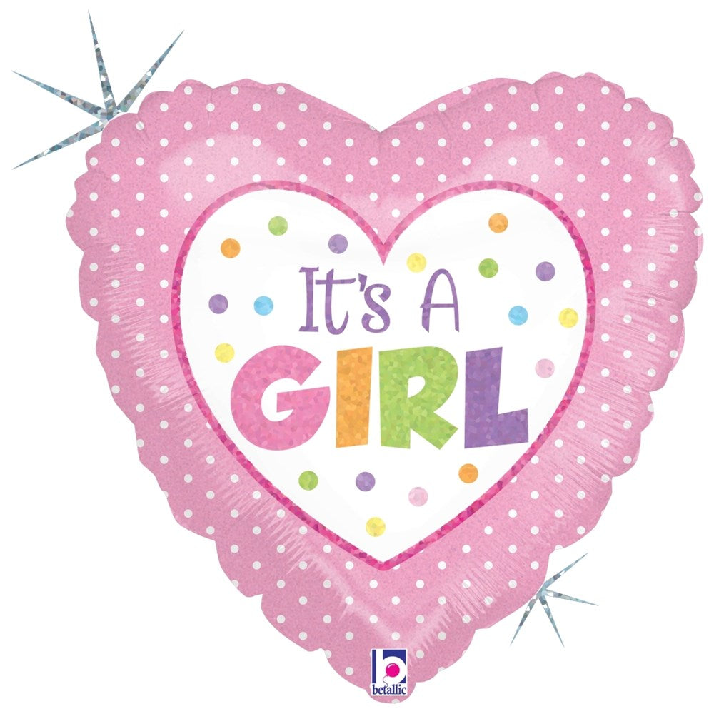 Pink heart-shaped foil balloon with white polka dots and "It's A Girl" text surrounded by colorful dots.