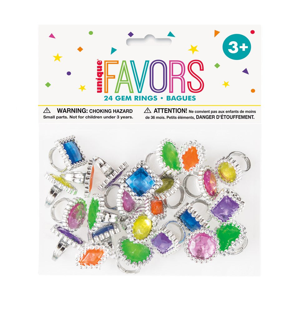 Colorful plastic gem rings in various shapes like hearts, squares, and ovals with silver-tone bands, packaged for party.