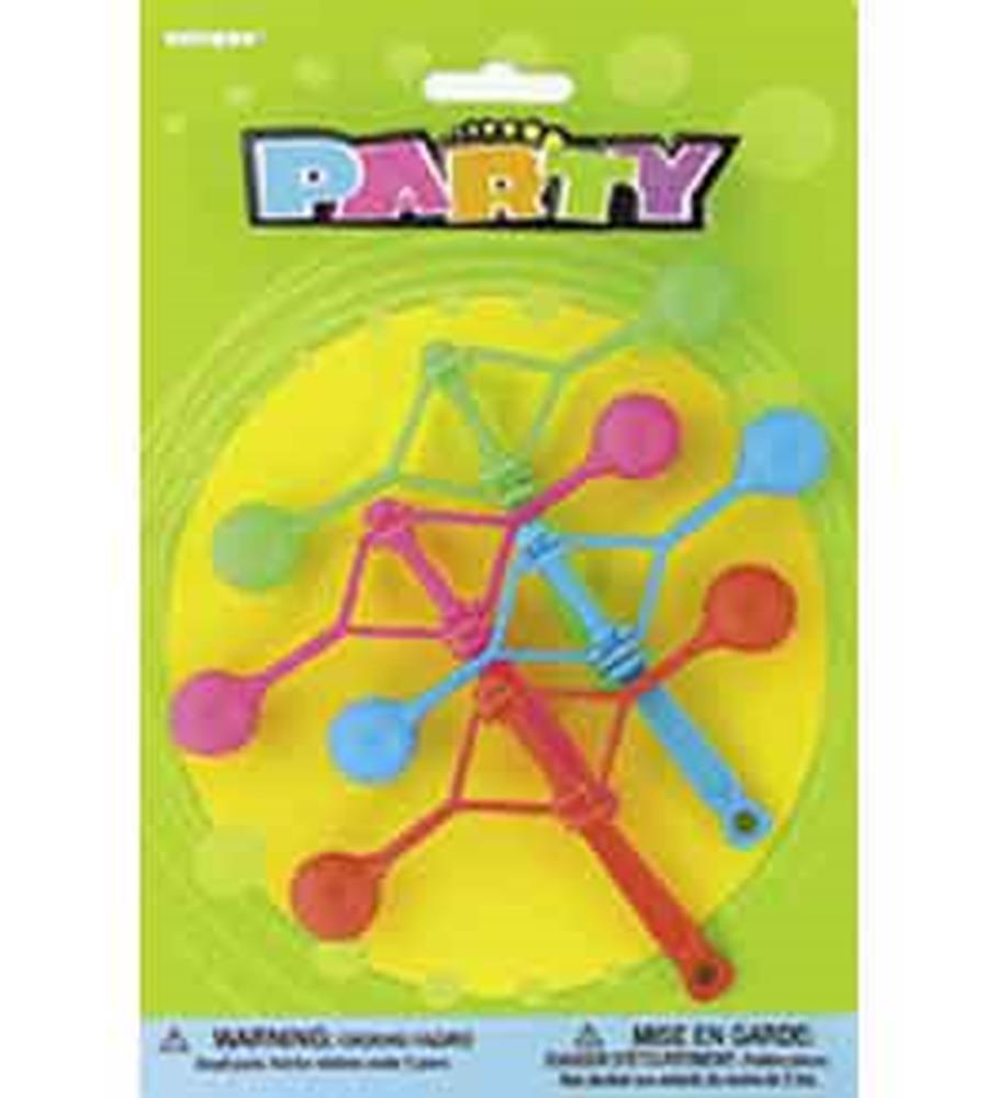 Four mini party klackers in pink, blue, and red with plastic handles on a yellow background in green packaging labeled.