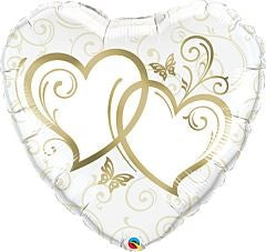 White heart-shaped foil balloon with entwined gold heart outlines and elegant swirl and butterfly patterns.