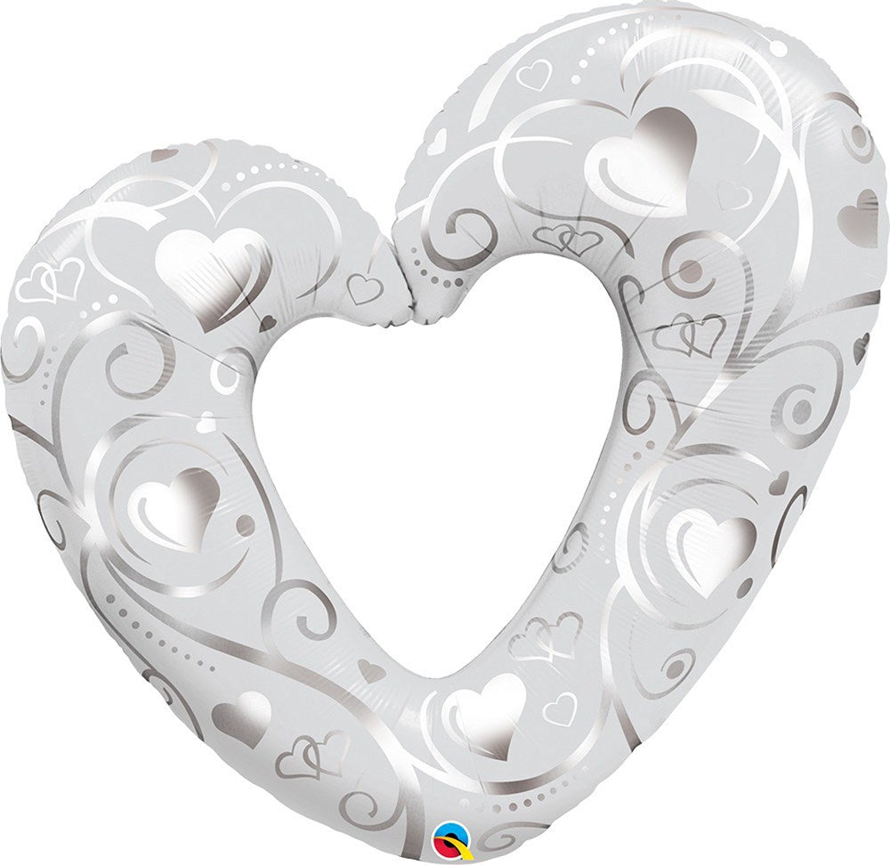 Pearl white heart-shaped foil balloon with cut-out hearts and silver swirl patterns, 42 inches.