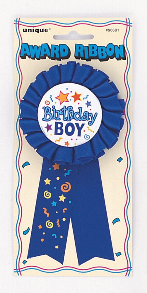 Blue birthday boy award ribbon with stars, swirls, and white center badge on packaging.
