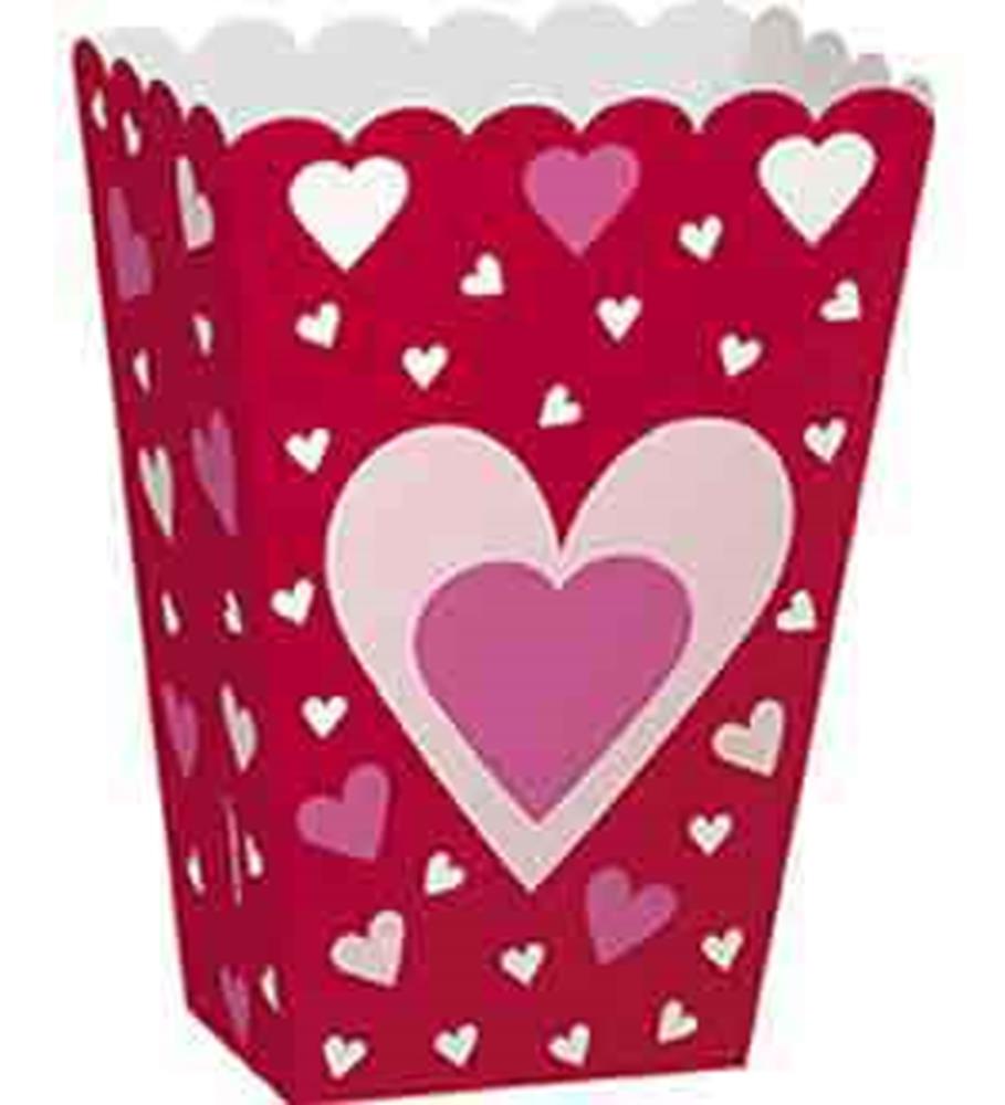 Red scalloped-edge treat box decorated with various sizes of pink and white hearts.