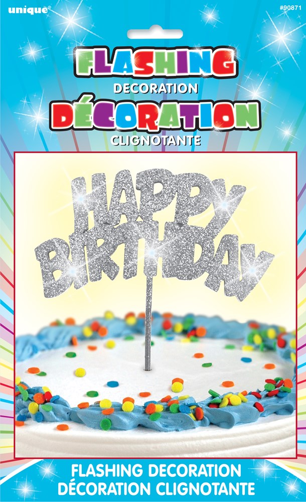 Silver glittery "Happy Birthday" pick with LED lights, inserted in a white frosted cake with colorful sprinkles.