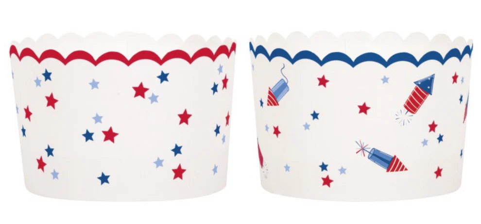White scalloped paper treat cups with red and blue star patterns and red scalloped trim on one, blue scalloped trim and.