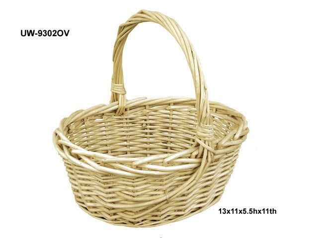 Oval woven wicker basket with single curved handle in light natural color.