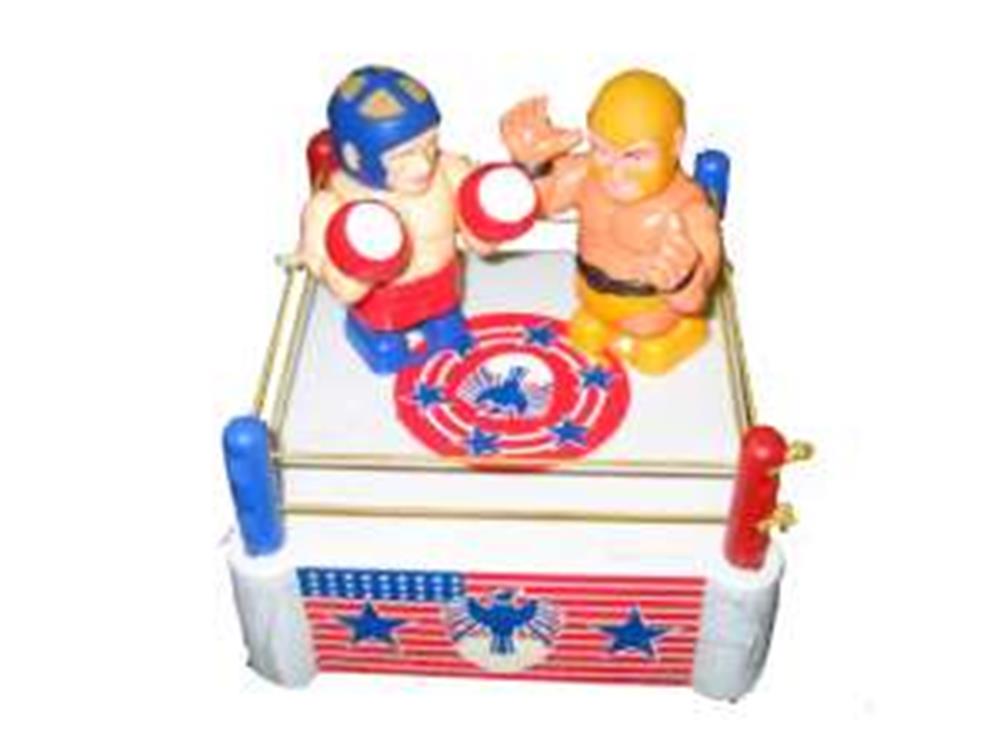 Mini wrestling ring toy with red, blue, and yellow plastic wrestlers and ropes on white square base.