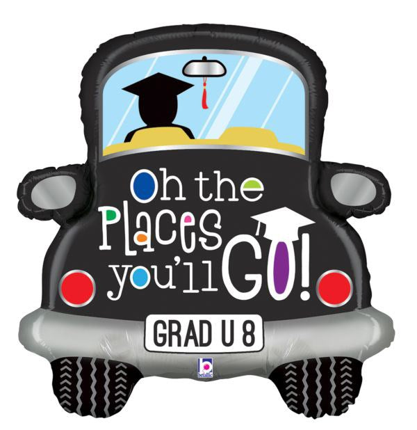Black foil balloon shaped like a car with a graduation cap on driver, colorful "Oh the places you'll go!" text, and "GRAD U.