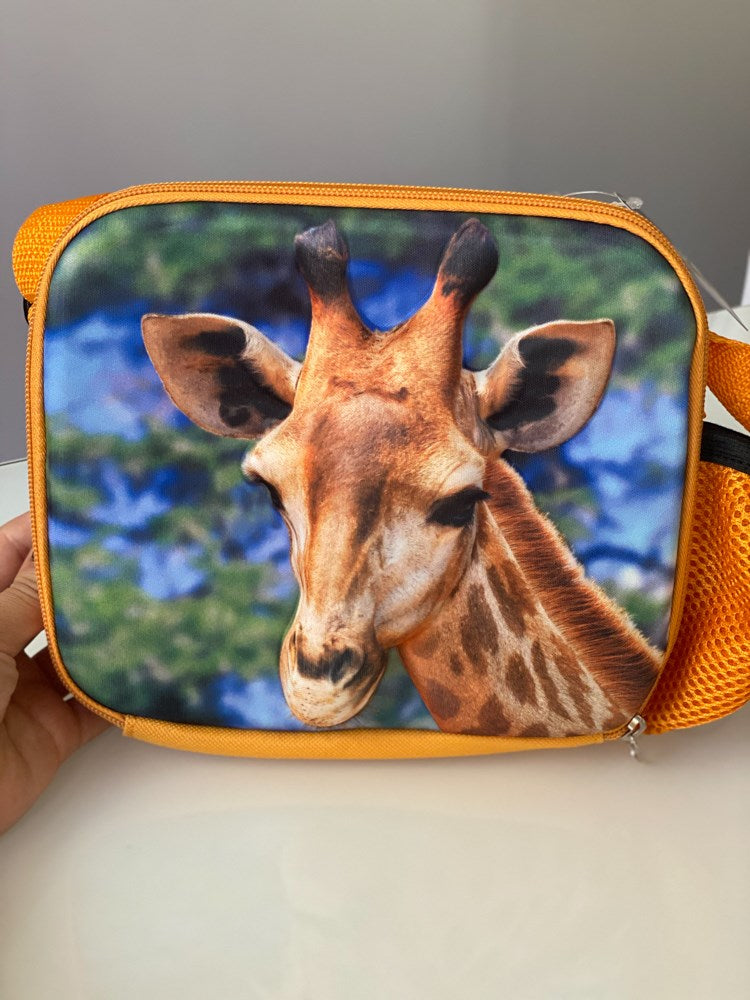 Orange lunch bag with a realistic giraffe face print on a blue sky background, textured foam material.