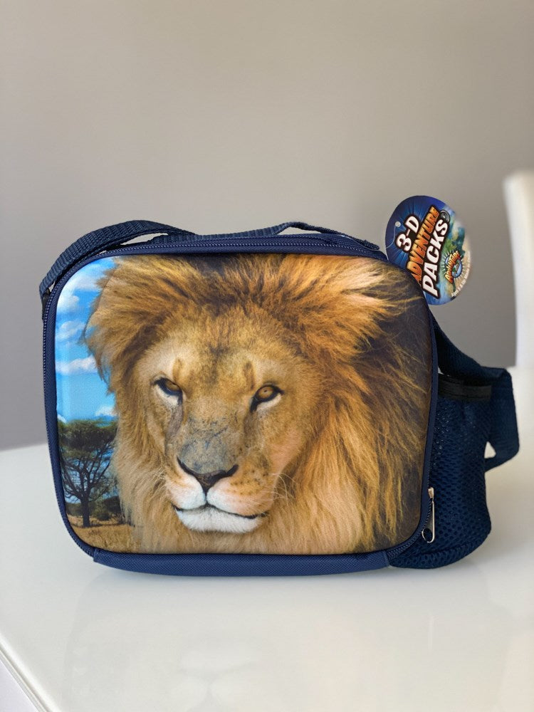 Navy blue lunch pack with realistic lion face 3D foam front panel and adjustable strap.