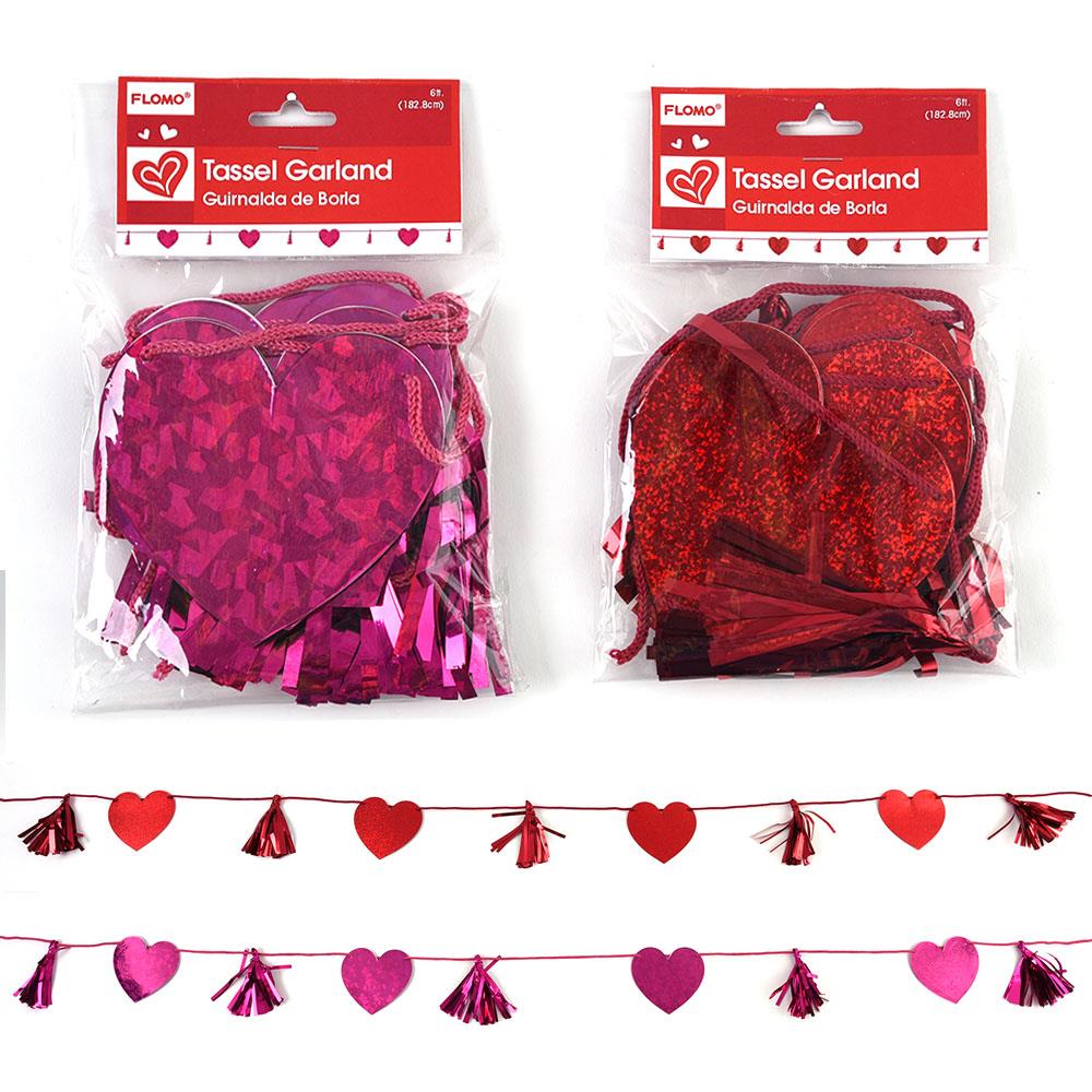 Valentine tassel garland with alternating red and pink foil heart shapes and matching tassels on string.
