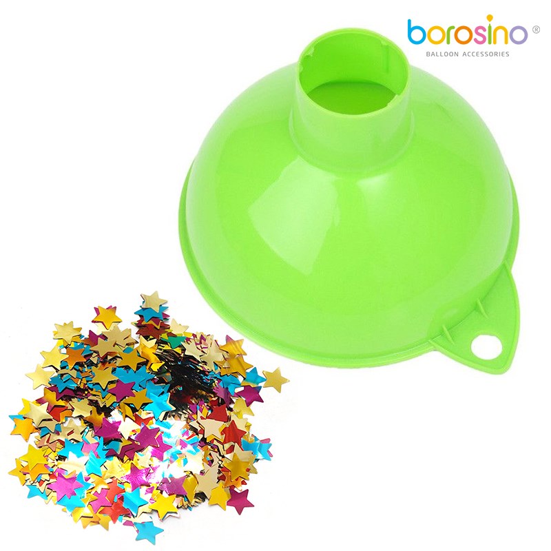 Bright green plastic funnel with a wide mouth and narrow spout beside colorful metallic star-shaped confetti.