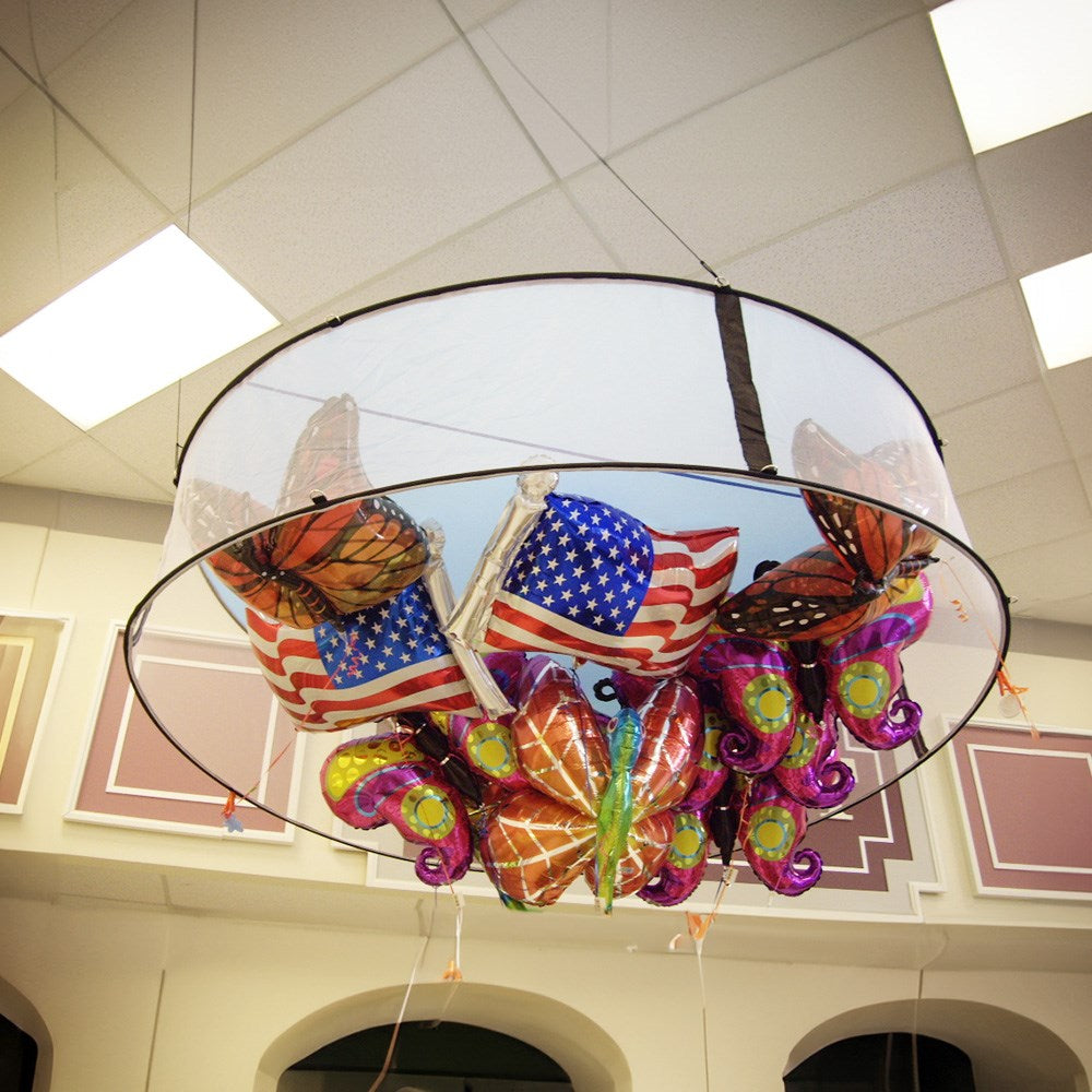 Large circular silver balloon corral with a 9-foot diameter holding colorful butterfly and American flag balloons inside.