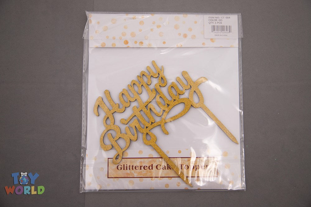 Gold glittered "Happy Birthday" cake topper with elegant cursive script and two stakes for inserting into cake.