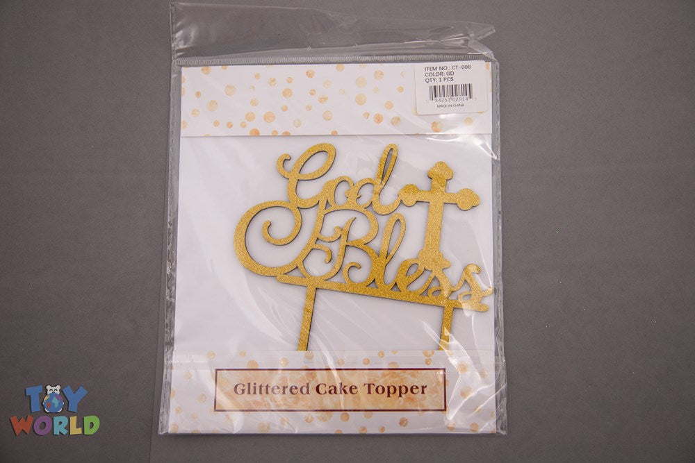 Gold glitter cursive script cake topper reading "God Bless" with two stick supports, packaged in clear plastic.