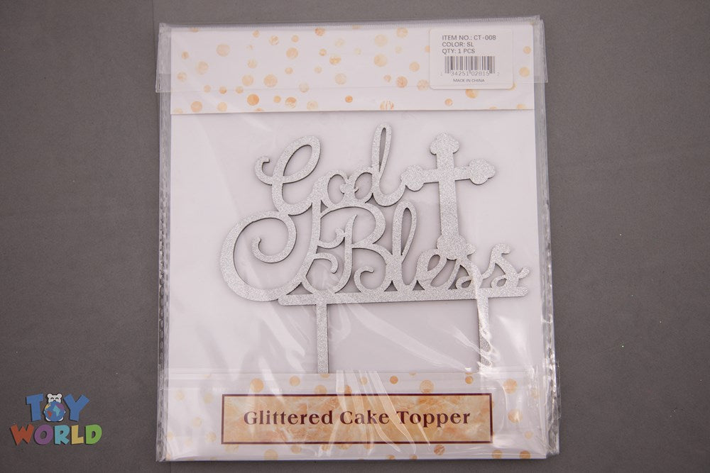 Silver glittered cake topper with cursive "God Bless" script and heart accents on two prongs.