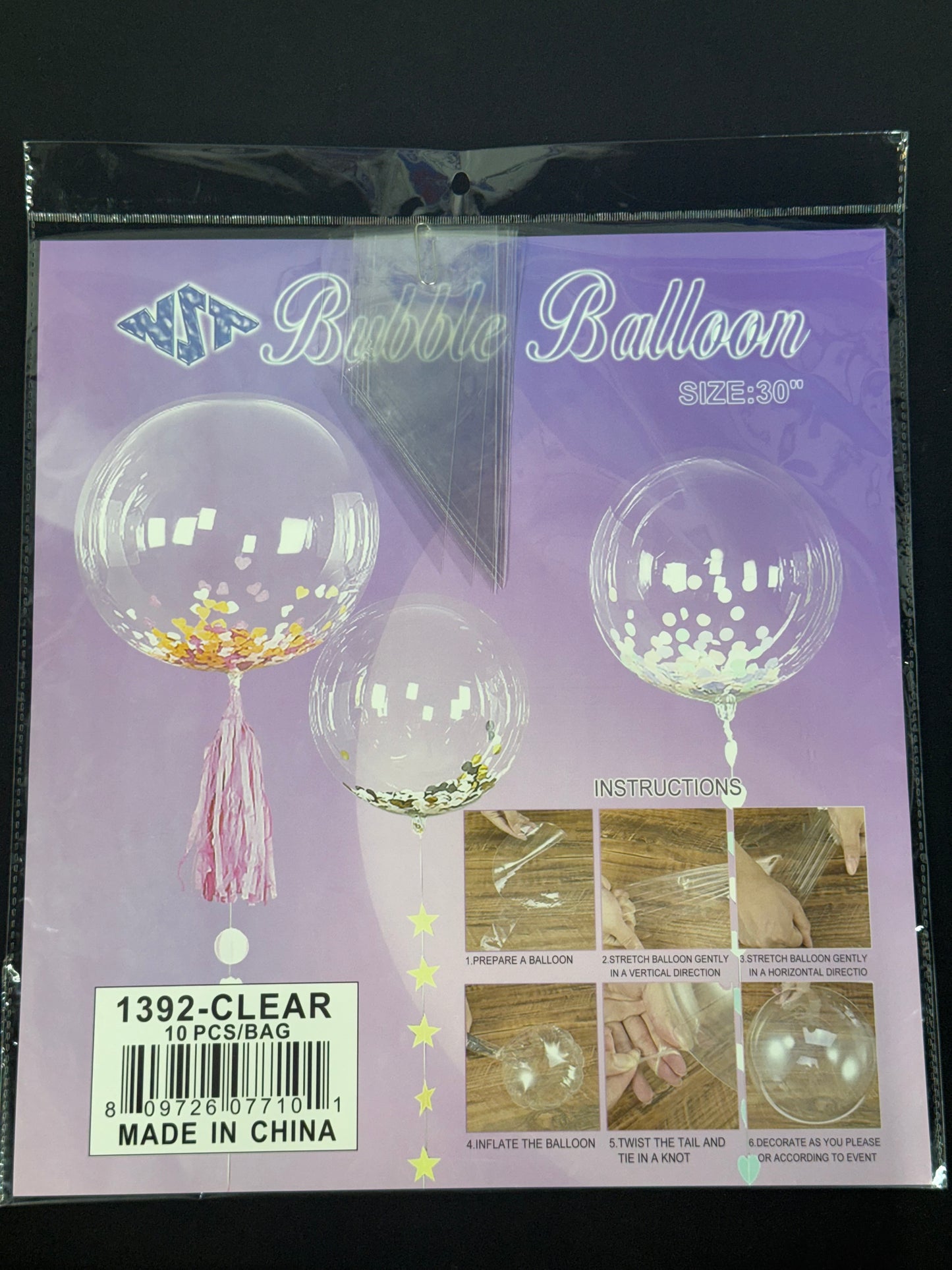 Set of four clear 30-inch bubble balloons decorated with confetti and tassel accents, party decor.