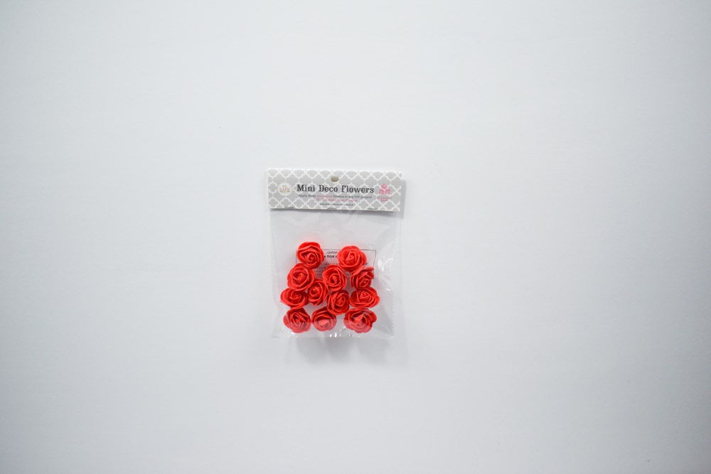 Twelve small red decorative foam flowers, each about 1 3/4 inches in diameter, in clear plastic packaging with label.