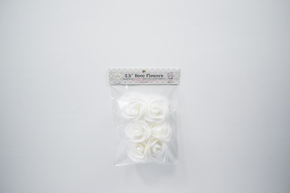 Set of six white foam flowers, each about 3.5 inches, with layered petals in clear plastic packaging.