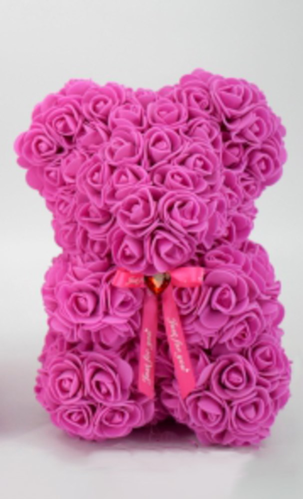 9.5-inch fuchsia teddy bear made of foam roses with a small red heart and pink ribbon on its chest.