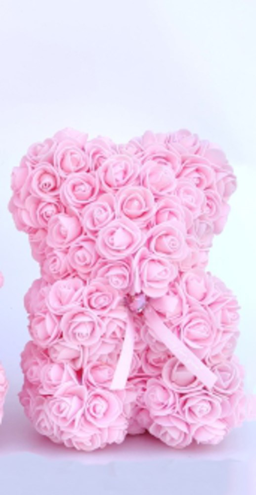 9.5-inch teddy bear made of pink foam roses with a matching pink ribbon bow around its neck.